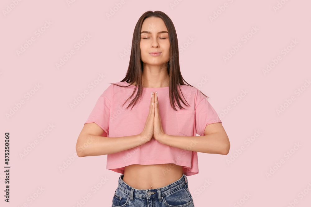 Sticker Young woman meditating near pink wall