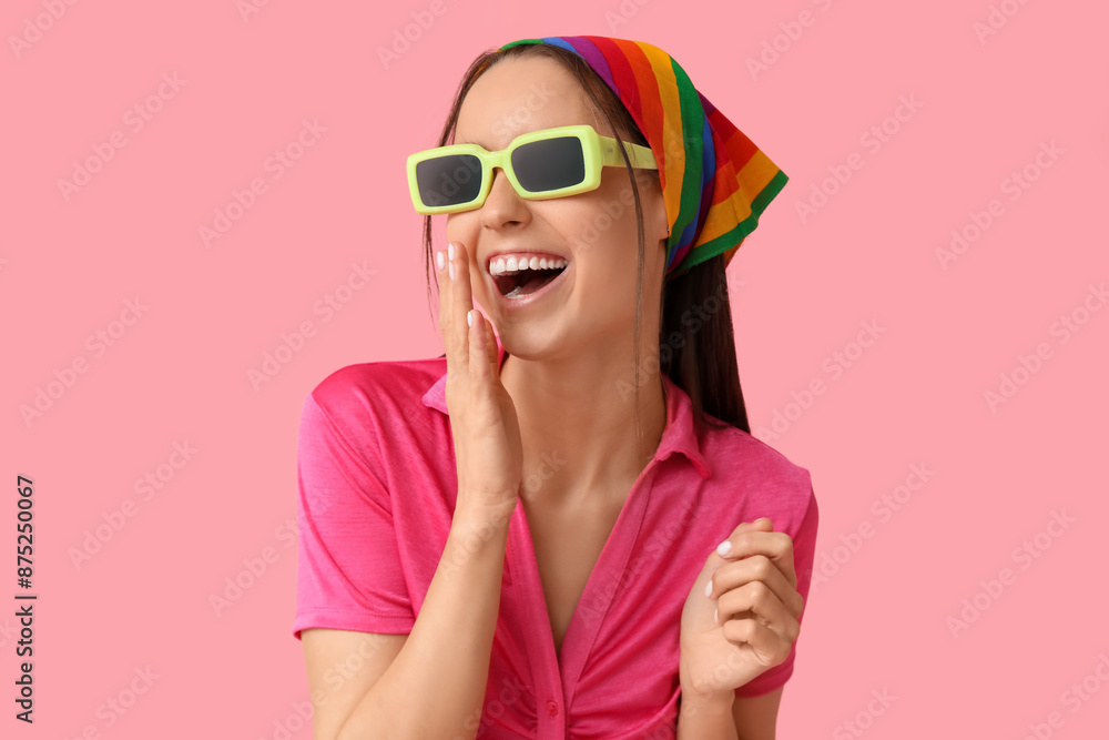 Sticker Beautiful young woman in rainbow hairscarf on pink background. LGBT concept