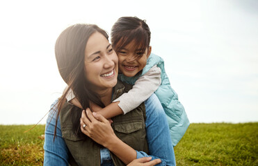 Mother, child and hug with love in field, play and nature in autumn for activity. Daughter, together and bonding with happy mom person with girl, outdoor and smile for holiday adventure for support