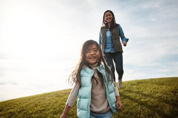 Daughter, field and walk with mother portrait, fun and woman in park for outdoor outing. Love, bonding and support from mom person and girl, grass and family in autumn for countryside together
