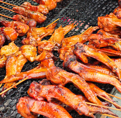 grilled chicken wings placed on metal grid