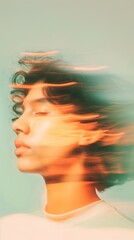 Blurred portrait of a person's face with eyes closed