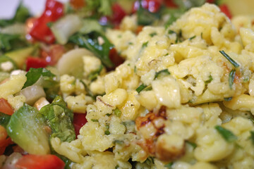 Scrambled eggs with chopped chives and stir-fried vegetables