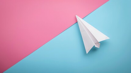 White paper plane is flying to the right isolated on pink and blue background