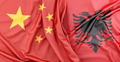 Fabric flag of China and Albania showing concept of diplomacy. 3D Rendering