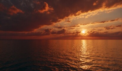 Dramatic sunset over calm ocean with vibrant colors