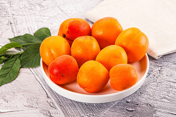 Raw ripe sweet apricots heap