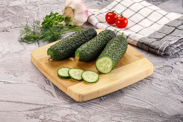 Raw green cucumbers with slices