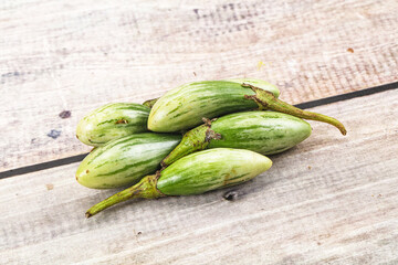 Small organic young green eggplant