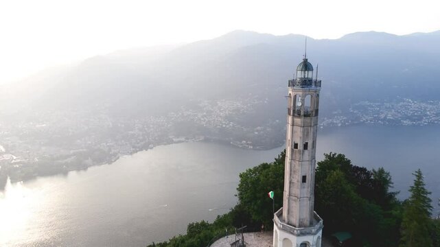 Aerial Reveal Pull Back Drone Footage of the Faro Voltiano Volta Lighthouse in Brunate, Como lake, Como province, Lombardy, Italy