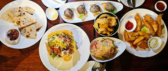 Dinner food on table set in restaurant for dinner or big meal