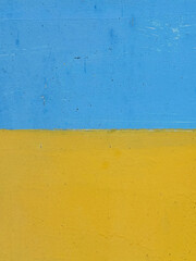 Blue and yellow weathered painted concrete wall background texture