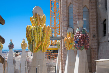 Grapes and ears of wheat on the pinnacles of the Sagrada Familia towers