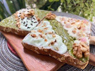 Matcha almonds butter toast with yoghurt and almonds mixed cacao nibs
