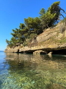 Scenic sea cove with rocks and pebble beach