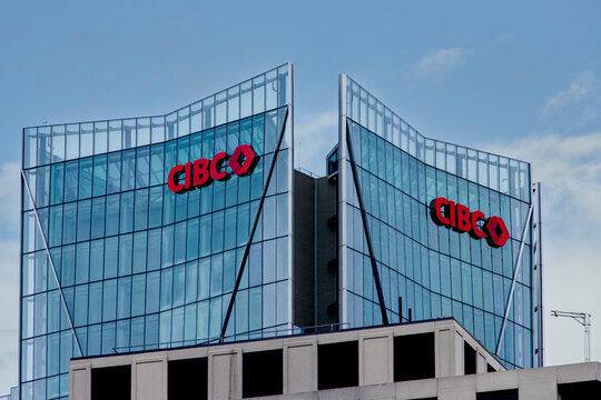Toronto, Canada, July 5 2024; New CIBC logo signs on the exterior of the new Canadian Imperial bank of Commerce banking tower on Lower Bay Street seen from the East