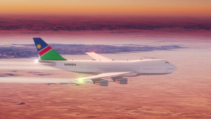 Commercial Airliner Passanger Plane Jumbo Jet Flying over Desert at Sunset with Country Flag Namibia