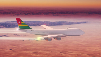 Commercial Airliner Passanger Plane Jumbo Jet Flying over Desert at Sunset with Country Flag Togo