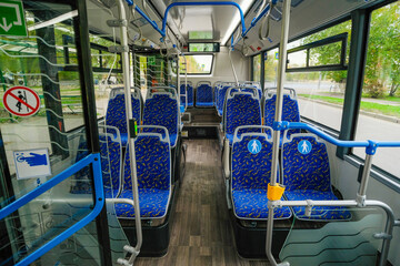 Empty bus interior. Seats without passengers. Public transport.