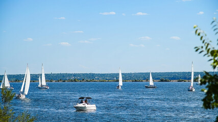 Sailboats compete in a sail regatta, race of sailboats