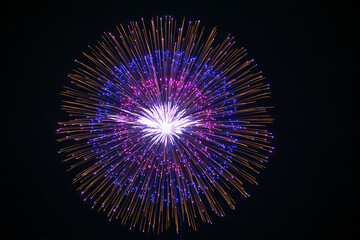 Huge multi coloured fireworks on the dark sky background. Fireworks festival celebration from Loto Quebec. 