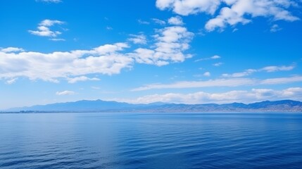 Fototapeta premium Endless blue horizons panoramic sea and sky view with clouds stretching to the infinite expanse