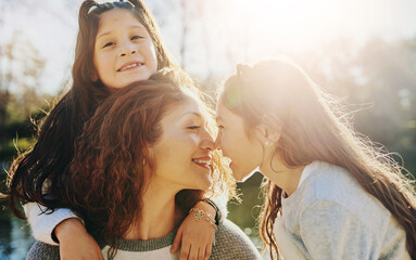 Love, nose and smile of mother with children outdoor in nature for bonding or playful development....