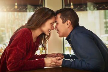 Restaurant, romance and couple holding hands with love on anniversary, date and empathy with care....