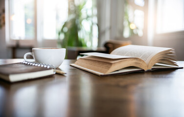 An open book for reading and relaxing with coffee drink and diary book for writing memoirs on wooden table in cafe