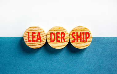 Leadership symbol. Concept word Leadership on beautiful wooden circles. Beautiful blue white background. Business leadership concept. Copy space.