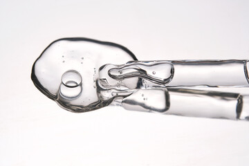 Pipette with cosmetic gel or serum close-up.