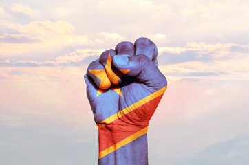 Man hand fist of DR Congo flag painted, fist flag, Strength, Power, Protest concept.