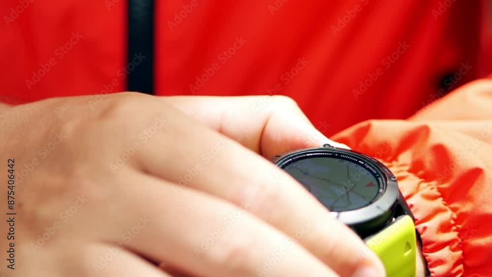 Poster man uses map in his smart watch to navigate his way, close-up shot