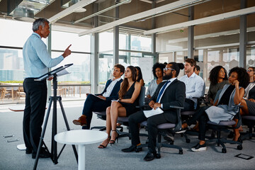 Businessman, coach and presentation with team in seminar for meeting, conference or speech at...