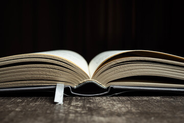 open book close up with bookmark