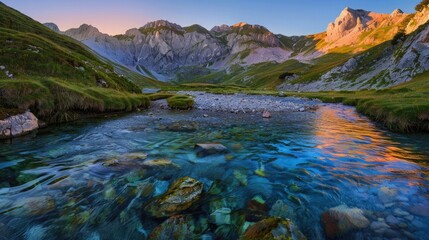 A tranquil mountain landscape with a range of gently rolling hills and clear blue streams, at sunset.