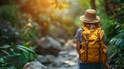 Obraz premium Hiker: A hiker traversing a narrow forest path. Outdoors. Adventure. Travel. Explorers. 