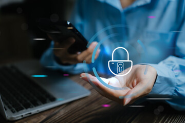 Person holding a smartphone with a digital lock hologram, symbolizing cybersecurity, data protection, or online privacy.