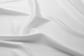 Texture of crumpled white silk fabric as background, closeup