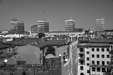 Panorama of the city of Poznan with modern skyscrapers and tenement house roofs