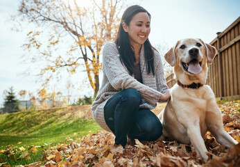 Woman, labrador and portrait outdoor in autumn season for wellness, love and walking pet with happiness. Female person, dog and smile on garden lawn for animal welfare, bonding and puppy training