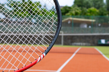Tennis racket on a tennis court. 
