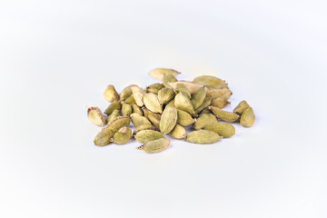 pile of cardamone seeds isolated on white background