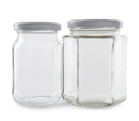 Two empty glass jars isolated on white