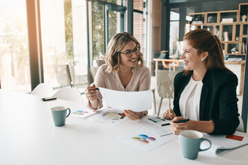 Paperwork, business or women in meeting for report, performance results or sales portfolio. Research, smile or happy financial analyst with documents or project notes for teamwork, trends or planning