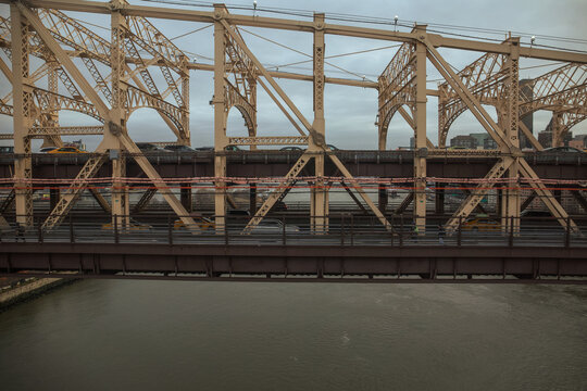 Aerial shot of the side of the 59th St Bridge aka the Queensboro Bridge aka the Ed Koch Bridge that connects Queens to Manhattan 