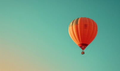 Fototapeta premium An inflated hot air balloon ascends into a clear blue sky