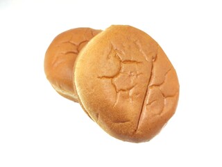 Photo of two burger buns, isolated on white background.