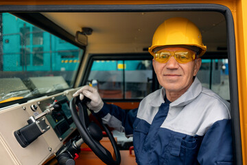 Man builder operate crane or excavator at construction site