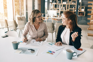 Documents, happy or business people in meeting for report, results or sales portfolio in office. Women, smile or financial analysts with paperwork or project notes for teamwork, trends or planning